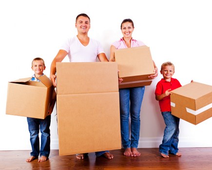 Movers helping to load a van with furniture in Paddington