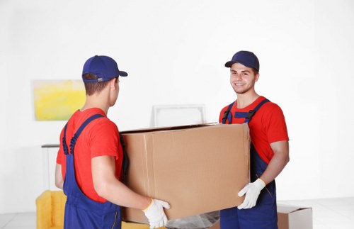 A professional moving team packing a home in Paddington